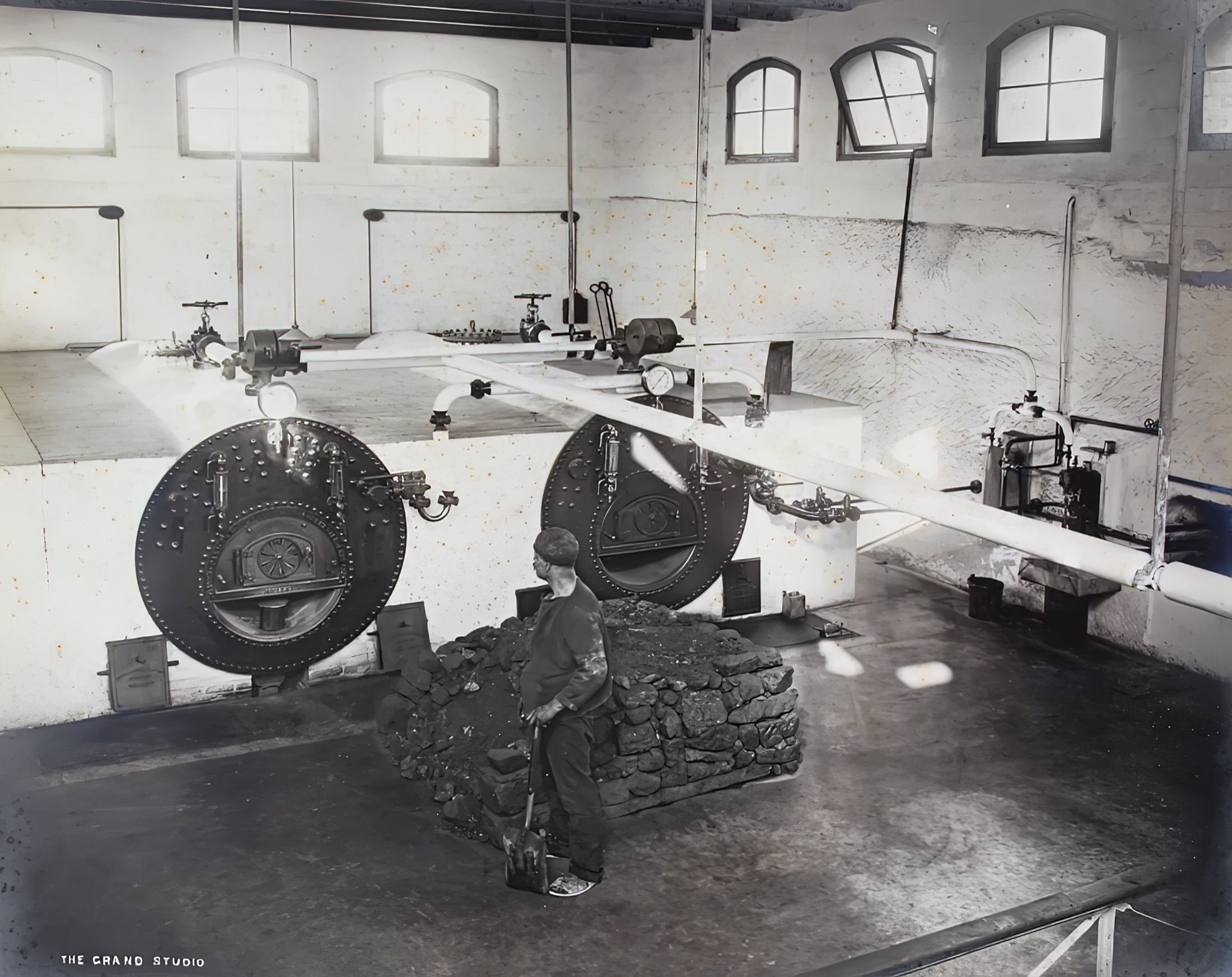 A worker stoking the boilers inside the Gżira Pumping Station